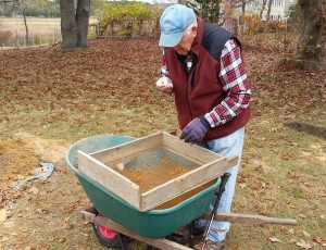 Jack Duggan, the archaeological coordinator for the Taylor-Bray Farm Preservation Association, finds a flake while sifting through soil on Tuesday.