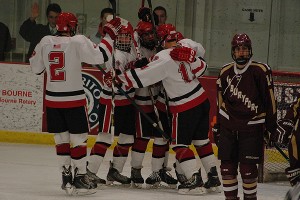 Barnstable High's Nick Dunne is swarmed after he makes it 4-1 in the home team's favor last night at the HYCC against Newburyport in the Cape Cod Freezeout. Sean Walsh/www.capecod.com sports