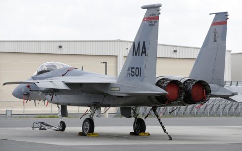 FILE - A Massachusetts Air National Guard F-15C fighter aircraft sits near a hangar at Barnes Air National Guard Base, in Westfield, Mass. (AP Photo/Steven Senne, File)