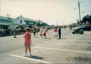 COURTESY PAUL CLERICI The runners cruise the final downhill to the Falmouth Road Race finish line on Grand Avenue in this photo by road race history author Paul Clerici.