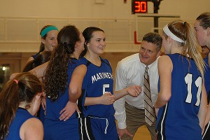 Falmouth Academy girls basketball head coach Gus Adams shares a laugh with Stephanie Aviles, Colleen Hall and Jane Earley after Aviles hit four straight jumpers in the 4th quarter. Sean Walsh/CCBM Sports