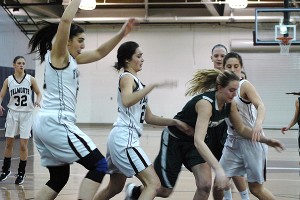 Falmouth High School's Alexa Johnson, Taylor Miller, Olivia Ferraro and Sarah Buscher continued to play a swarming style of defense in last night's 53-48 Division 2 South semifinals win over Hingham. Sean Walsh/Capecod.com Sports