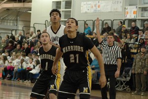 Nauset's Razz Green (21) turned in a double-double in last night's 38-37 Warrior win over Falmouth. Nauset's Mark Takajian and Falmouth's Leo DeOliveira fight for position behind him. Sean Walsh/capecod.com sports