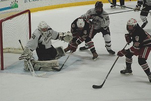 Falmouth co-captain Nick Cline tries to save this wrist shot from Catholic Memorial's Gunnar McKenzie in the 1st period of Saturday's 6-1 loss. The goal made it 1-0. Sean Walsh/CCBM Sports