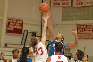Barnstable junior center Megan Dombrowski poured in a key 10 points to help the Red Raiders to victory Friday night, seen here at tip-off with Kia Fernandes of Wareham. Sean Walsh/CCBM Sports