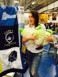 Julia Douglas hugs some stuffed turnips at the Eastham Turnip Festival
