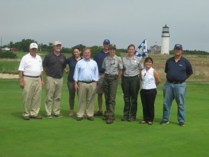 CCB MEDIA PHOTO Officials from the Cape Cod National Seashore, Johnson Golf Management on the first hole green at Highland Links Golf Course in North Truro.