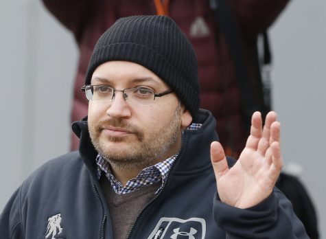 U.S. journalist Jason Rezaian waves as he poses for media people in front of Landstuhl Regional Medical Center in Landstuhl, Germany, Wednesday, Jan. 20, 2016. Rezaian was released from an Irani prison last Saturday. (AP Photo/Michael Probst)