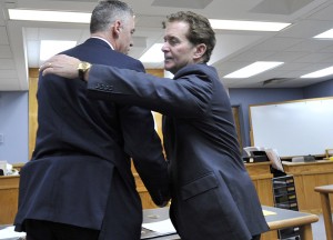 Brian Hyde, left, hugs his attorney Drew Segadelli after Judge Mary Orfanello found Hyde not guilty. Court pool photo/Steve Heaslip