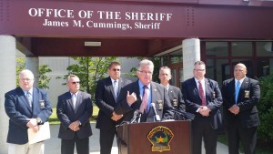 CCB MEDIA PHOTO Barnstable County Sheriff Jim Cummings gathers with other law enforcement officials in Boure to discuss immigration policies.