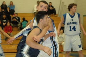 Cape Cod Academy's senior captain Johnny Hatem is guarded closely by Mashpee's Gino Fellini in last night's 53-51 thriller. The Falcons won. Sean Walsh/capecod.com sports