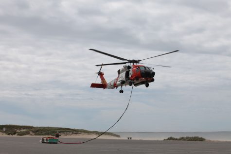 CCB MEDIA PHOTO Coast Guard Crews from Air Station Cape Cod cargo lifted 18 tons of material Monday in Chatham for the Monomoy Lighthouse and keeper's house restoration project.