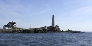 FILE -- In this Aug. 23, 2004 file photo Boston Light sits on Little Brewster Island in Boston Harbor. Boston Light, the nation's first and oldest lighthouse, and the U.S. Coast Guard's last manned station, is celebrating 300 years of warning mariners as they navigate the tricky waters of Boston Harbor. (AP Photo/Josh Reynolds, File)