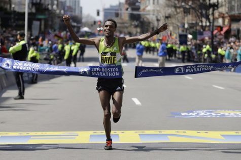 Lemi Berhanu Hayle, of Ethiopia, breaks the tape to win the 120th Boston Marathon on Monday, April 18, 2016, in Boston. (AP Photo/Elise Amendola)