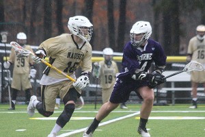 Nauset's Marc Takajian speeds by Bourne High's Nick Pavilonis in Friday's 10-9 overtime win for the Warriors. Phil Garceau photo for Capecod.com Sports