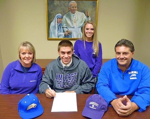 St. John Paul II middle infielder Matt Santos signed his letter of intent to play for the Amherst Lord Jeffs yesterday, seen here with his mother Amy and father Mark Santos, SJP II Head Baseball Coach, and the couple's daughter Allison. Photo courtesy of SJPII Athletics