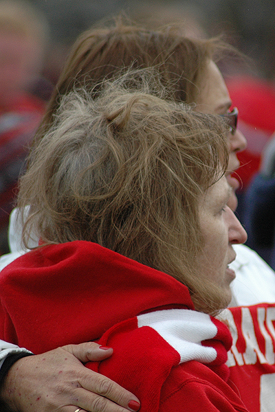 Janette Anderson, mother of late US Navy SOC Kevin A. Houston (SEAL), comforts her close friend Meg Chaffee during the retirement ceremony for Houston's Red Raider football jersey # 46. Photo by Sean Walsh/CCBM Sports Editor