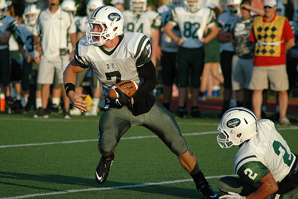 Senior quarterback Mike Dunn scored four touchdowns to pace the D-Y Dolphins to a 52-0 Turkey Day rout over host Nauset.Photo by Sean Walsh/CCBM Sports