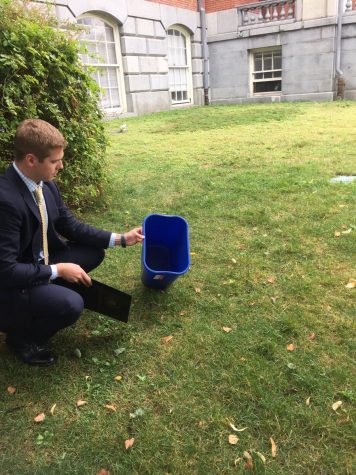 Tim Buckley releases a mouse on the Statehouse lawn. Photo courtesy: Twitter
