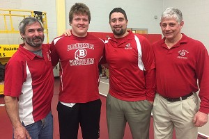 HIS MENTORS - Barnstable High wrestling coaches Mark Barrett, Kyle Cocozza Jr. and Dr. Peter Bertucci share a proud moment with their pupil: New England Heavyweight Wrestling Champion Owen Murray of Barnstable High School. Photo courtesy of Kristin Murray