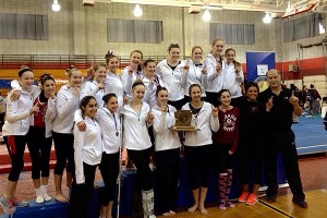 The Barnstable High School gymnastics team poses with its 4th New England Championship trophy Saturday at Pinkerton Academy in Derry, NH. Photo courtesy of Jillian Pacheco
