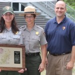 Nicole Taylor holds her Northeast Region Safety Award, with CCNS Deputy Superintendent Kathy Tevyaw, and NPS Northeast Regional Director Mike Caldwell. 