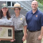 Nicole Taylor holds her Northeast Region Safety Award, with CCNS Deputy Superintendent Kathy Tevyaw, and NPS Northeast Regional Director Mike Caldwell.