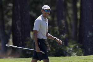President Barack Obama smiles after putting on the first green during a round of golf at Farm Neck Golf Course in Oak Bluffs, Mass., on Martha's Vineyard, Sunday, Aug. 7, 2016. The president and his family are vacationing in the Massachusetts island of Martha's Vineyard. (AP Photo/Manuel Balce Ceneta)