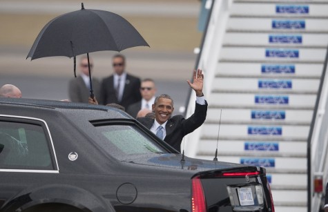President Barack Obama waves upon arrival to Jose Marti International Airport in Havana, Cuba, Sunday. (AP Photo/Fernando Medina)