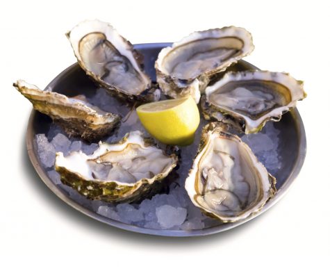 Oysters with lemon on plate