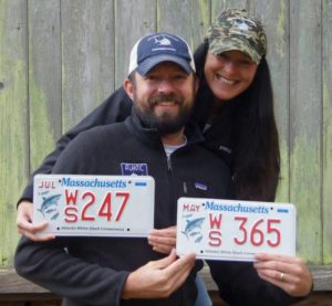 Cynthia and Ben Wigren with their license plates