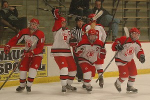 Barnstable High School's Meghan Moore (11), co-captain Nicole Derosier (23), co-captain Lindsey Phelan (2), Amanda Picknick (18) and Caroline Spalt (22) celebrate Phelan's third period goal to tie it 3-3. Sean Walsh/www.capecod.com sports