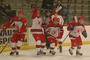 Barnstable High School's Meghan Moore (11), co-captain Nicole Derosier (23), co-captain Lindsey Phelan (2), Amanda Picknick (18) and Caroline Spalt (22) celebrate Phelan's third period goal to tie it 3-3. Sean Walsh/www.capecod.com sports 