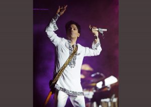 FILE - In this April 26, 2008 file photo, Prince performs during the second day of the Coachella Valley Music and Arts Festival in Indio, Calif. Prince's publicist has confirmed that Prince died at his home in Minnesota, Thursday, April 21, 2016. He was 57. (AP Photo/Chris Pizzello, File)
