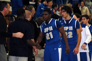 St. John Paul II's Diego Meritus (21), Jonny Warden and Nick Cassata all played well last night but it was not enough as the Lions were eliminated from the postseason by Southeastern Regional Voke, 56-55. Sean Walsh/Capecod.com Sports file photo