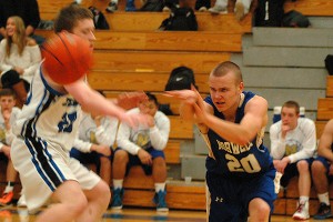 Mashpee's Billy McNamara tried to defend a laser-focused Stephen Kulka from Norwell High Tuesday night in a tough, 48-38 loss for the Falcons. Sean Walsh/CCBM Photos