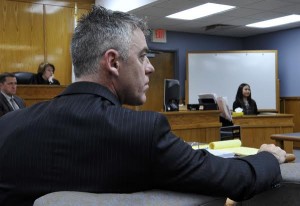 FALMOUTH-- 02/16/16- Brian Hyde listens to his attorney Drew Segadelli question Isabel King about Hyde's visit to their house during the trial at Falmouth District Court on Tuesday Court Pool Photo/Steve Heaslip