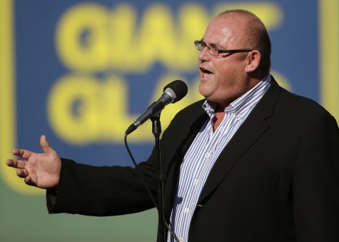 Ronan Tynan sings "God Bless America" during the seventh inning stretch of a baseball game between the Boston Red Sox and the New York Yankees Sunday, Sept. 28, 2014, at Fenway Park in Boston. (AP Photo/Steven Senne)