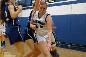 Cape Cod Academy's Victoria Alberico drives to the basket as Eliza and Charlotte Van Voorhis try to slow her down. Sean Walsh/capecod.com sports