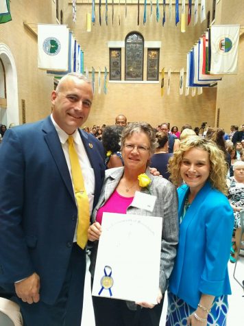 Christine Morin, middle, receives 2016 Unsung  Heroine Award Wednesday at the State House. Also pictured are Rep. Timothy Whalen and his Chief of Staff, Rebecca Hamlin.
