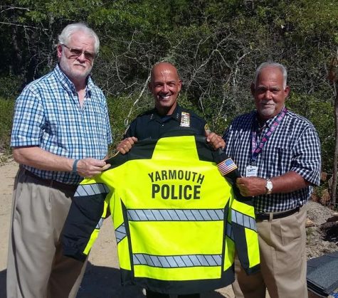 Yarmouth Police Foundation President Bruce Wilson (right), with Yarmouth Deputy Police Chief Steven Xiarhos (center) and Foundation Vice-President Mike Sahagian.