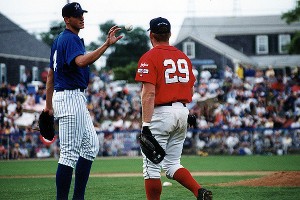 Kansas City Royals pitcher Chris Young (left) gets the ball from former Big League star and Bourne Braves third baseman Kevin Youkilis when Young and "Yuke" played for the Cape League All-Star team at Veterans Field against Team USA on July 29, 2000. Sean Walsh/Capecod.com Sports