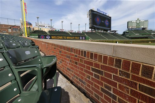 In this Monday, Oct. 19, 2015, photo, a seat where Chicago Cubs fan Steve Bartman sat as left fielder Moises Alou reached into the stands unsuccessfully for a foul ball tipped by Bartman is seen during a team workout for Game 3 in baseball's National League Championship Series between the Chicago Cubs and the New York Mets in Chicago. Twelve years after that fateful night when he deflected a foul ball that appeared destined to land in Alou's glove and help land the Cubs in the World Series for the first time since 1945, it is tough to find someone who has a bad thing to say about Steve Bartman. (AP Photo/Charles Rex Arbogast)