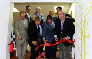 CCB MEDIA PHOTO Cutting the ribbon at the new addiction treatment center, Cape Cod Behavioral Health, are, from left, front, Ken Weber, Kent Clarkson, Harry Turner and Mike Jackman from US Congressman Bill Keating's office, and, back row, from left, Michael Kasparian, Susan Moran, and State Sen. Vinny deMacedo.