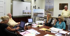 CCB MEDIA PHOTO Developer Stuart Bornstein stands at right as members of the Hyannis Main Street Waterfront Historic District discuss his plans. Commission Chairman George Jessop, at left, talks to architect Elizabeth Whittaker, while committee member Marina Atsalis is at right.