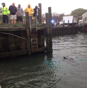 COURTESY OF THE CHATHAM POLICE DEPARTMENT A Chevy pickup truck drives into the water off the Chatham Fish Pier Wednesday morning.