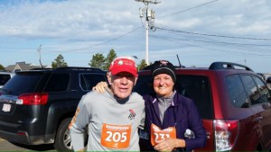 COURTESY LARRY COLE Larry Cole at the Plymouth America's Hometown Thanksgiving Race in November 2014. He stands with Karla Hanson of Holden, who turned 60 in 2015 in time to run the Boston Marathon in the 60 to 64 category.