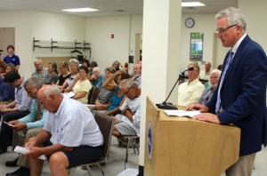 CCB MEDIA PHOTO Chairman of the Falmouth Board of Selectmen Doug Jones reads a letter to the Cape Cod Commission stating his board's opposition to the project to construct a Marriott hotel on Main Street in Falmouth.
