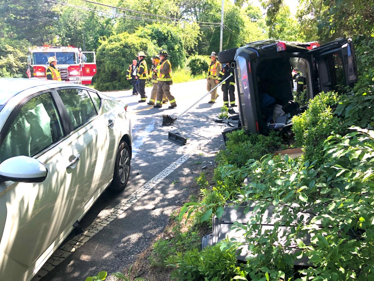 Video report Several trapped after rollover crash on Route 6A in