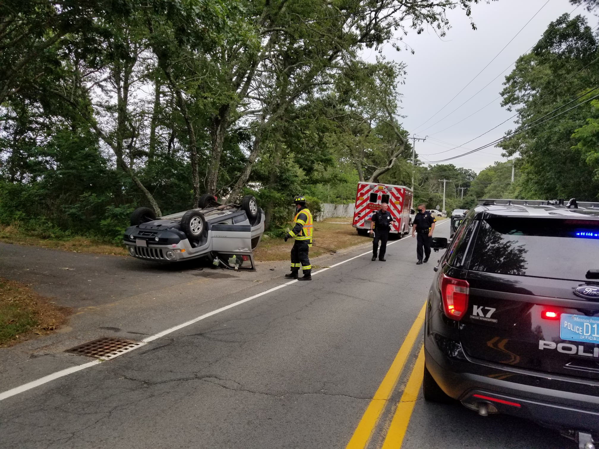 Two injured after crash leaves car on roof in Brewster